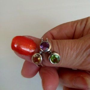 Sterling silver bezel set three stone ring.